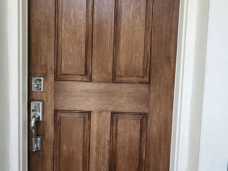 The same Jupiter front door stained a rich medium brown with the wood grain showing