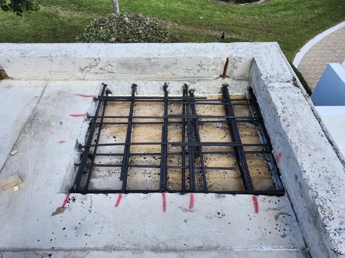Slab cut open to replace reinforcing steel, the new rebar tied in a grid